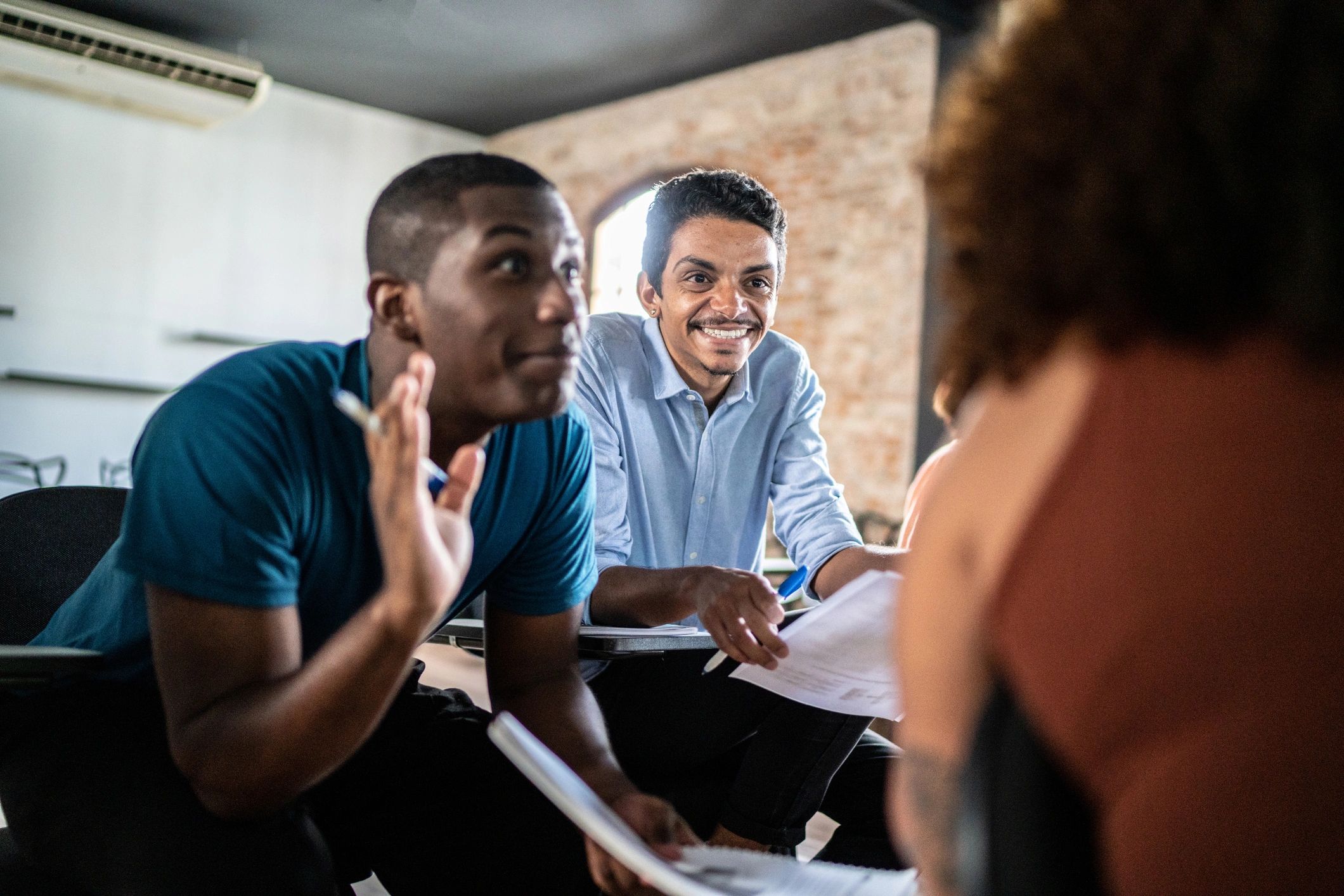 Young adults collaborating in a classroom setting